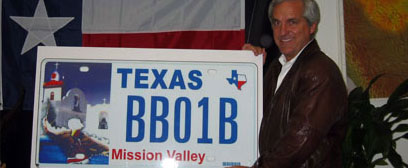 Senator Shapleigh showing off the Mission Valley license plate