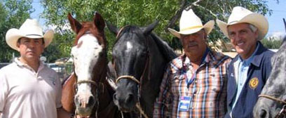 With Senator Uresti horseback blockwalking in Socorro